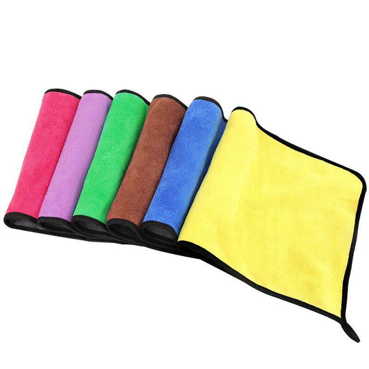 Microfiber cloth wiping a window to a streak-free finish