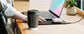 Laptop sleeve charging phone on built-in wireless pad