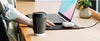 Laptop sleeve charging phone on built-in wireless pad