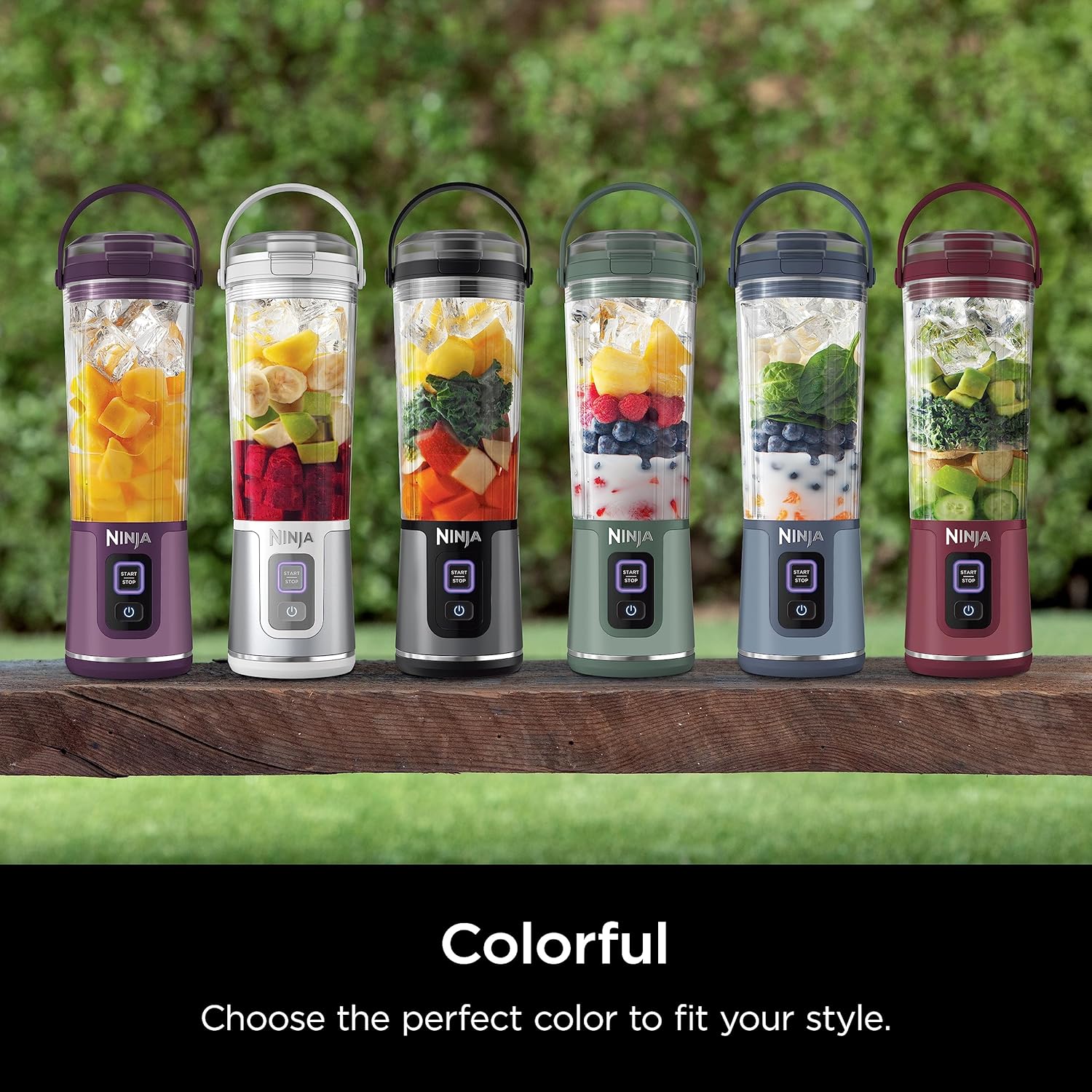 Cordless portable blender making a fresh fruit smoothie in a travel cup