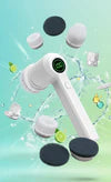 Hand holding PureSpin scrubber cleaning kitchen sink