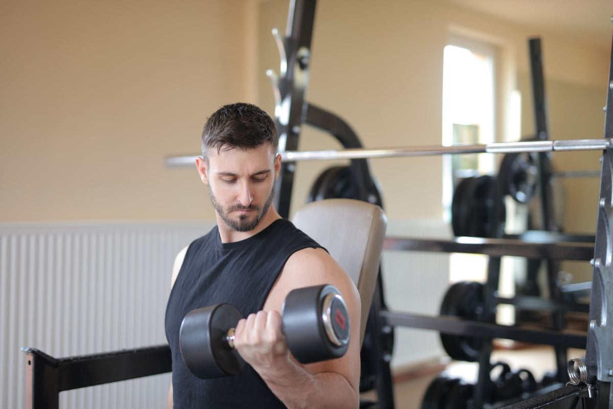 Young man training with a dumbbell